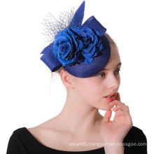 Small Blue Fascinator With Sinamay Loops, Flower And Netting for Wedding Church Party